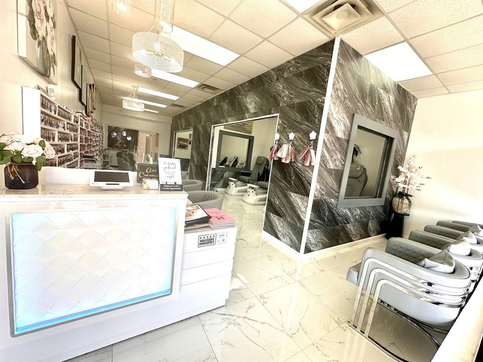 Nail salon stations with manicure tools.