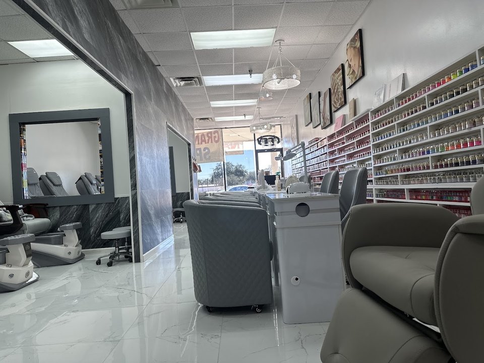 Nail salon stations with manicure tools.